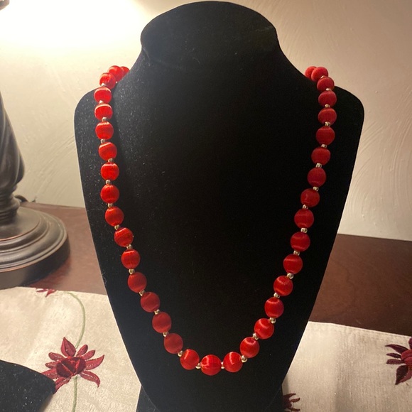 Red fabric covered beaded necklace.  Tiny silver beads between the red. - Picture 1 of 3